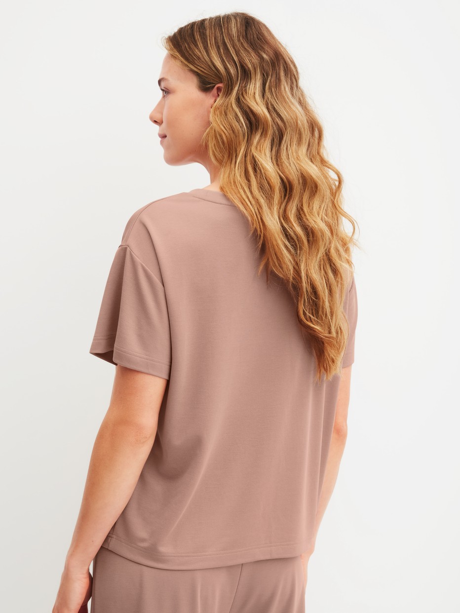 Women model is wearing Shirt short sleeve made of Modal in Brown, Unicoloured from the Natural Loungewear series by CALIDA, Back view
