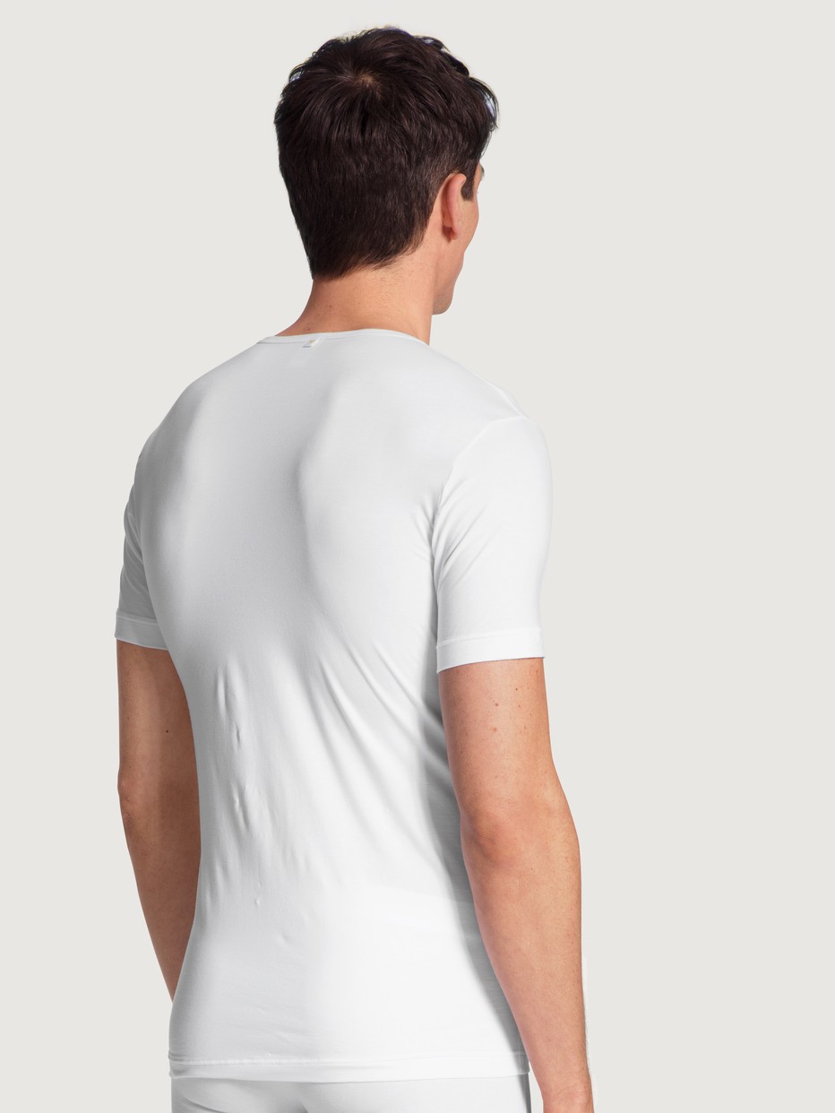 Men model is wearing T-Shirt made of Lyocell in White, Unicoloured from the Focus series by CALIDA, Back view