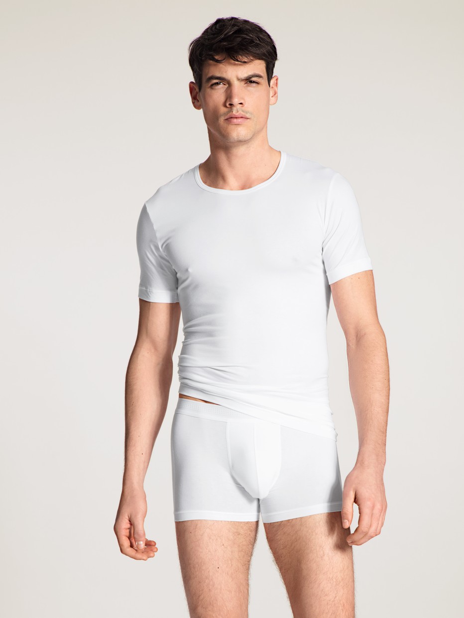 Men model is wearing T-Shirt made of Lyocell in White, Unicoloured from the Focus series by CALIDA, Outfit