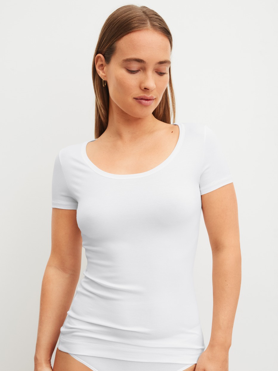 Women model is wearing Shirt short sleeve made of Modal in White, Unicoloured from the Soft Favourites series by CALIDA, Front View