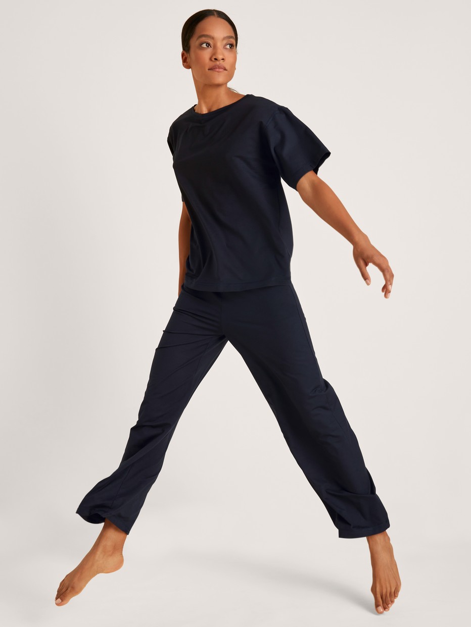 Women model is wearing Shirt short sleeve made of Modal in Blue, Unicoloured from the DSW Balancing series by CALIDA
