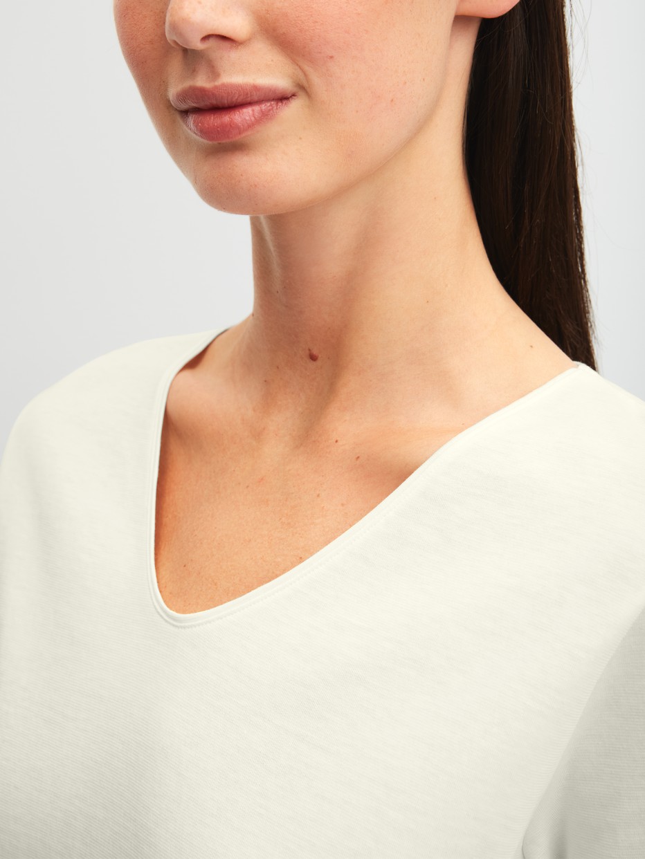 Women model is wearing Shirt shortsleeve made of 100% Cotton in White, Unicoloured from the Favourites Ocean series by CALIDA, Detail