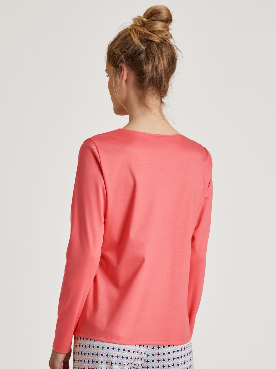 Women model is wearing Shirt long sleeve made of 100% Cotton in Pink, Unicoloured from the  series by CALIDA, Back view
