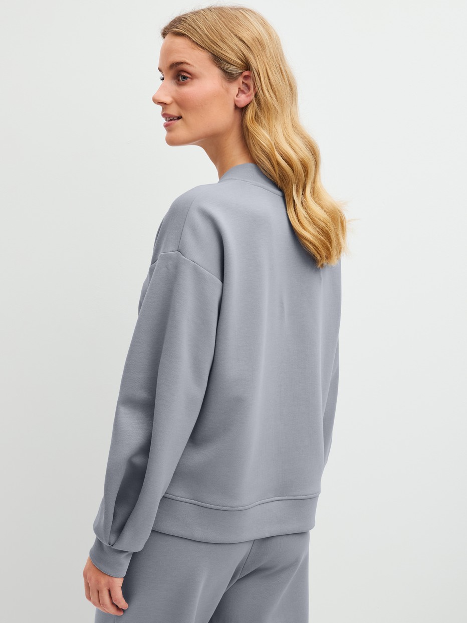 Le mannequin Femme porte le/la  en Coton de couleur Gris, Unicolore, de la série Natural Embrace de CALIDA, Vue arrière