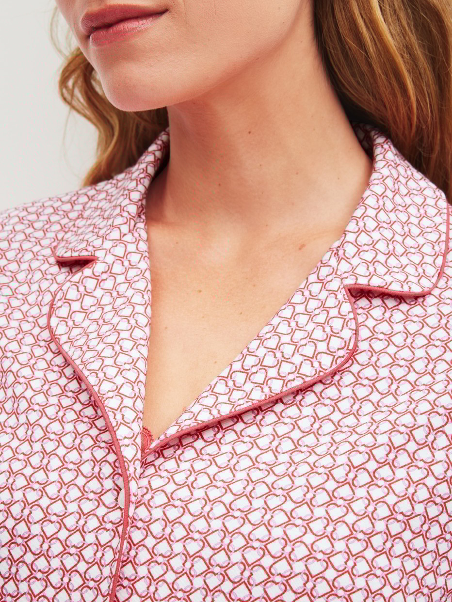 Women model is wearing Long-sleeved shirt with buttons made of Cotton in Pink, Patterned from the Favourites Love series by CALIDA, Detail