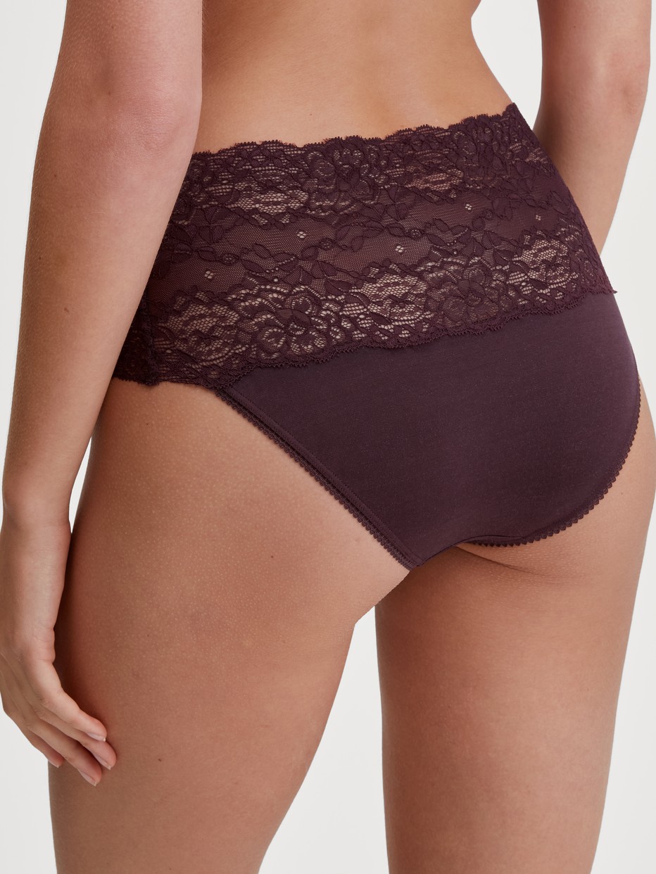 Women model is wearing High-waisted briefs with lace waistband made of Lace in Red, Lace from the Sensual Secrets series by CALIDA, Back view