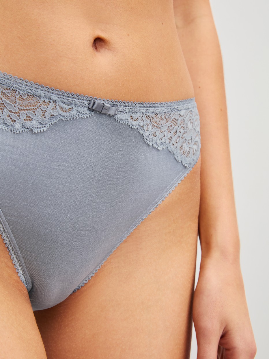 Women model is wearing Brief, regular cut made of Lace in Grey, Lace from the Sensual Secrets series by CALIDA, Detail