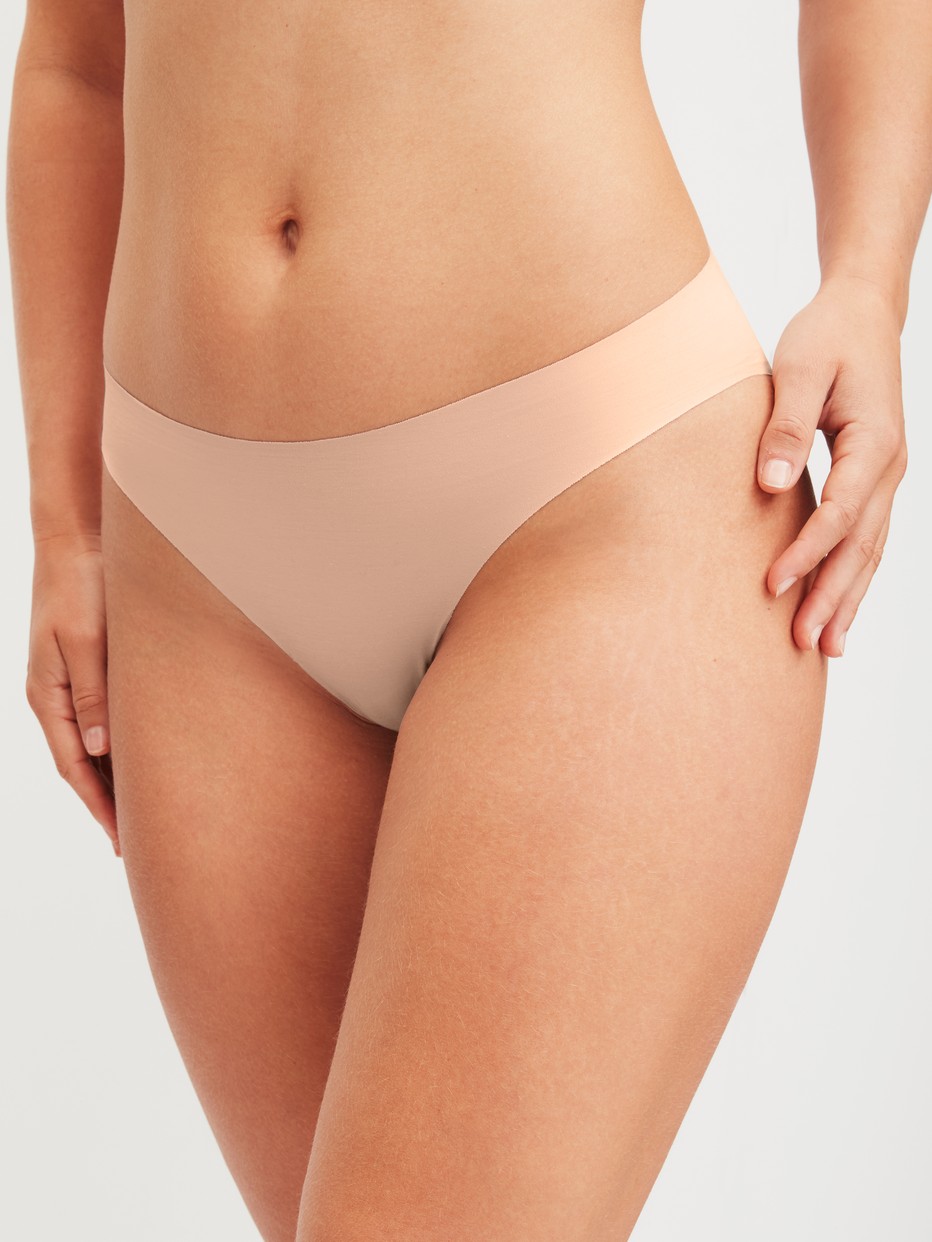 Women model is wearing Seamless Brazilian Brief made of Modal in Pink, Unicoloured from the Natural Skin series by CALIDA, Front view