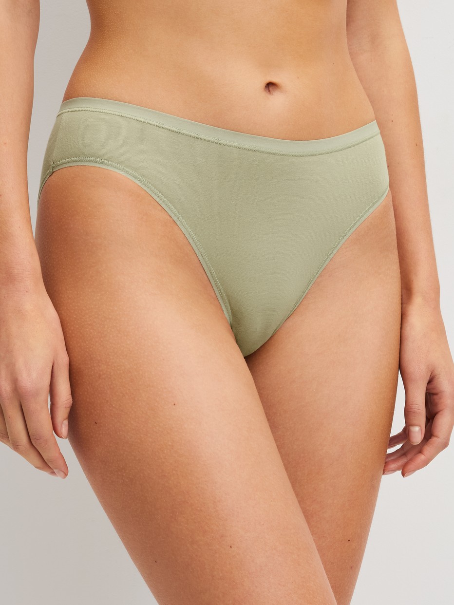 Women model is wearing Briefs, 2-Pack made of Cotton in Green, Unicoloured from the Benefit Women Spec. series by CALIDA, Front view
