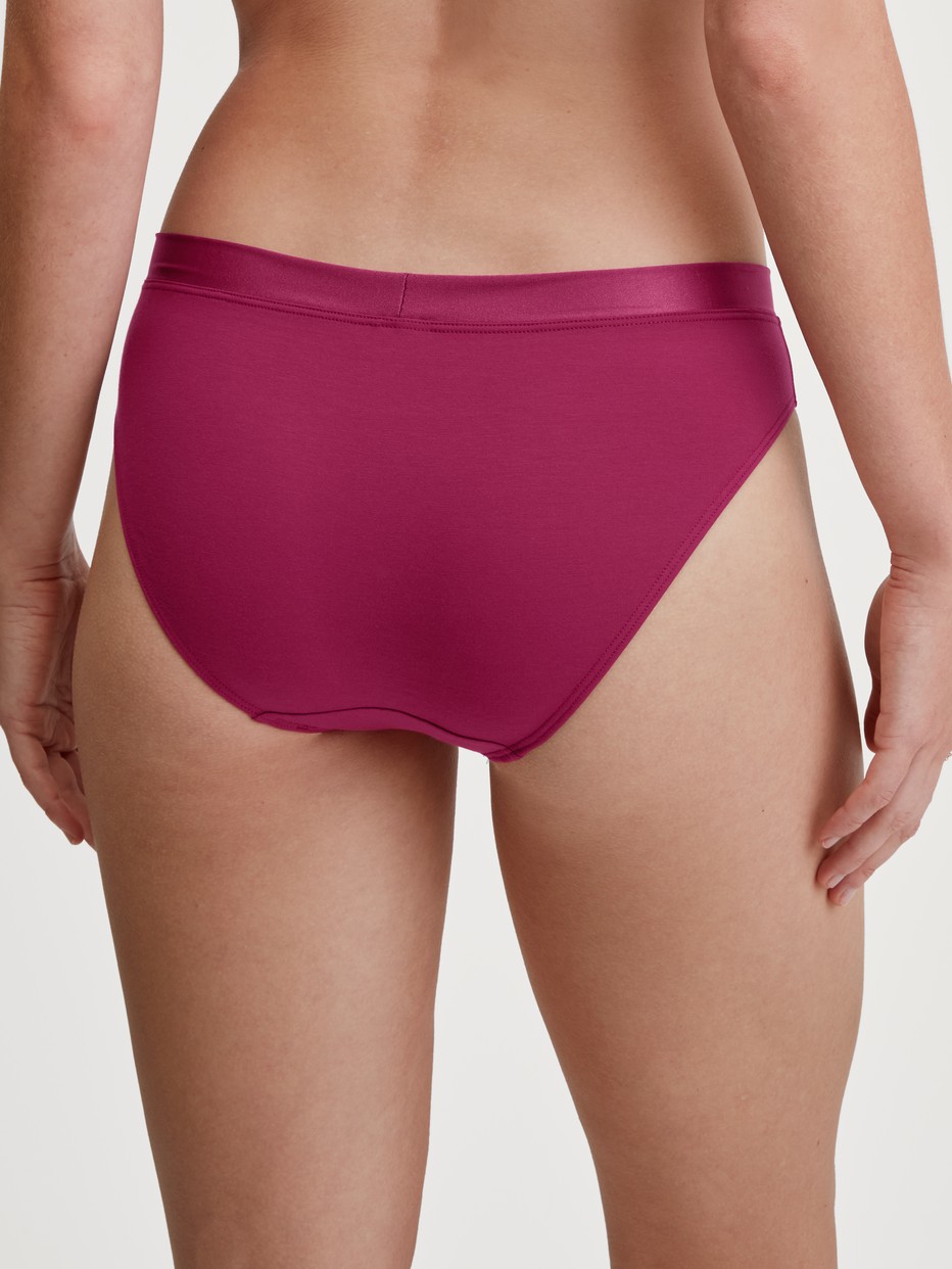 Women model is wearing Brief made of Cotton in Pink, Unicoloured from the Cate series by CALIDA, Back view