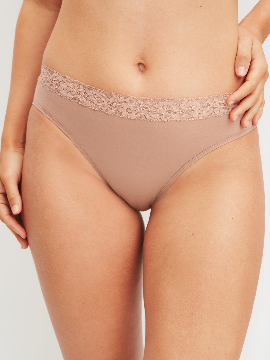 Women model is wearing Brief, regular cut made of Cotton in Brown, Lace from the Natural Comfort Lace series by CALIDA, Front view