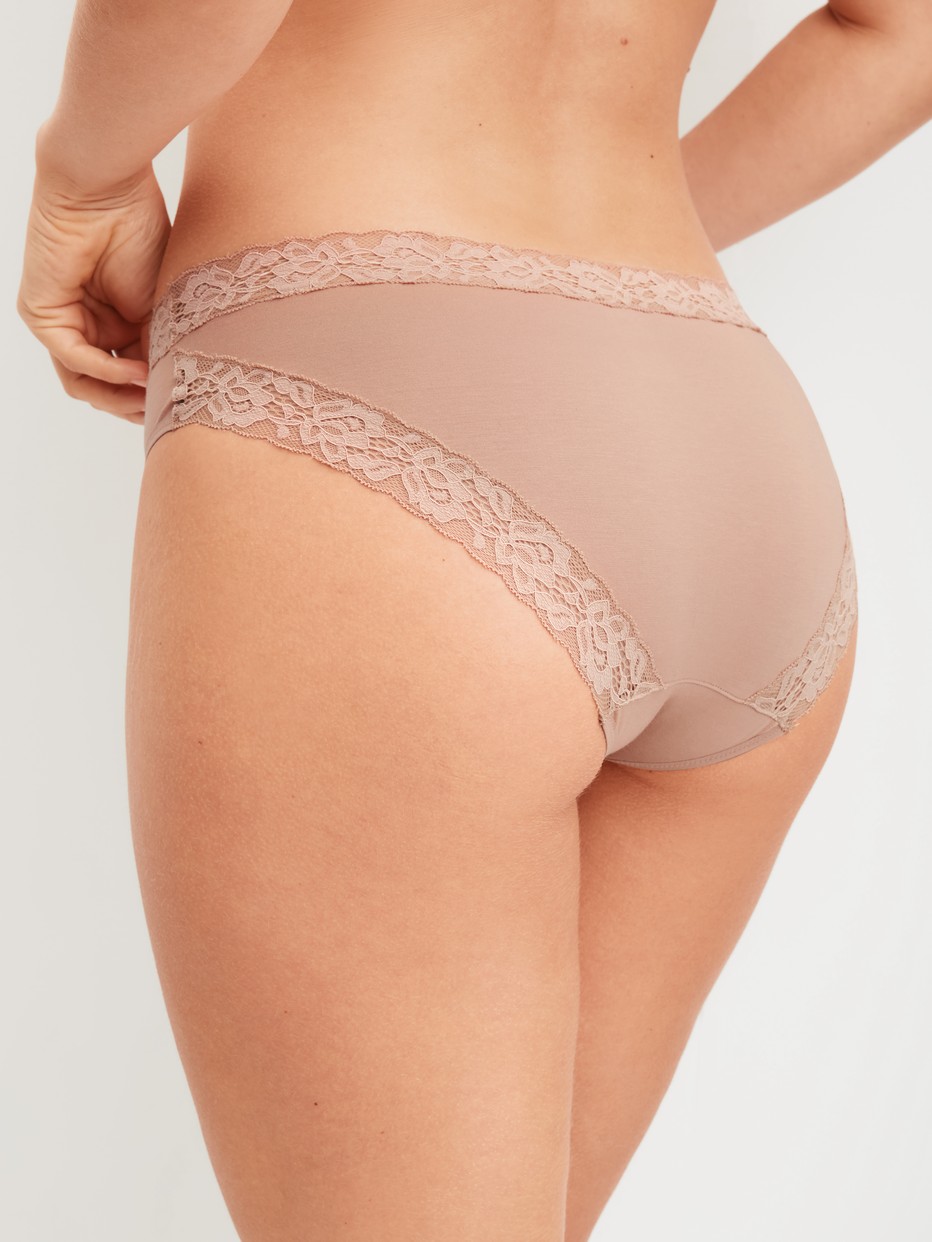 Women model is wearing Brief, regular cut made of Cotton in Brown, Lace from the Natural Comfort Lace series by CALIDA, Back view