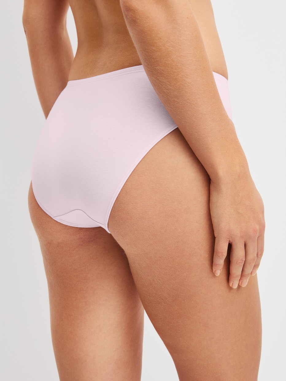Women model is wearing Brief, regular cut made of Cotton in Pink, Unicoloured from the Essential Cotton series by CALIDA, Back view