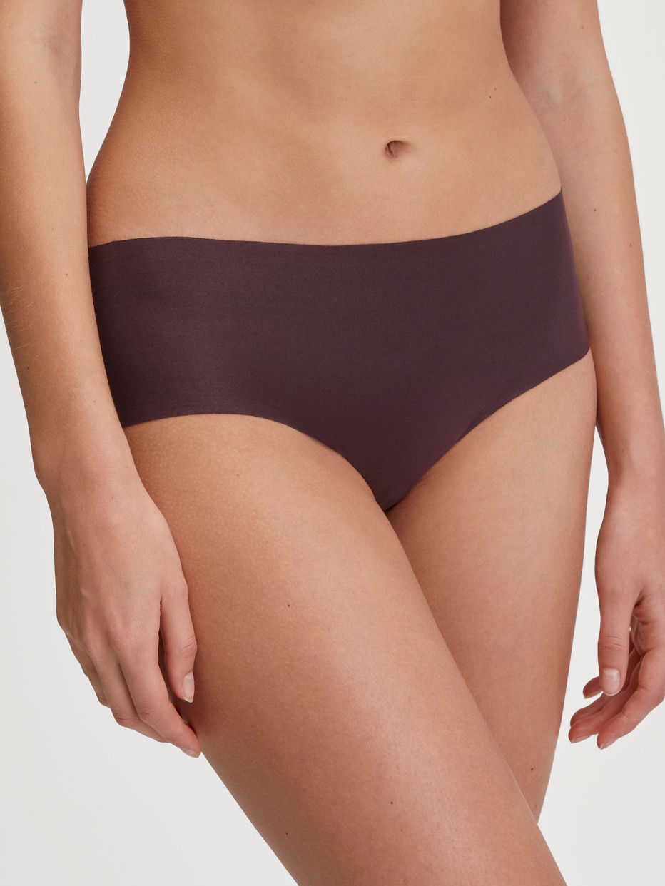 Women model is wearing Panty made of Modal in Red, Unicoloured from the Natural Skin series by CALIDA, Front view