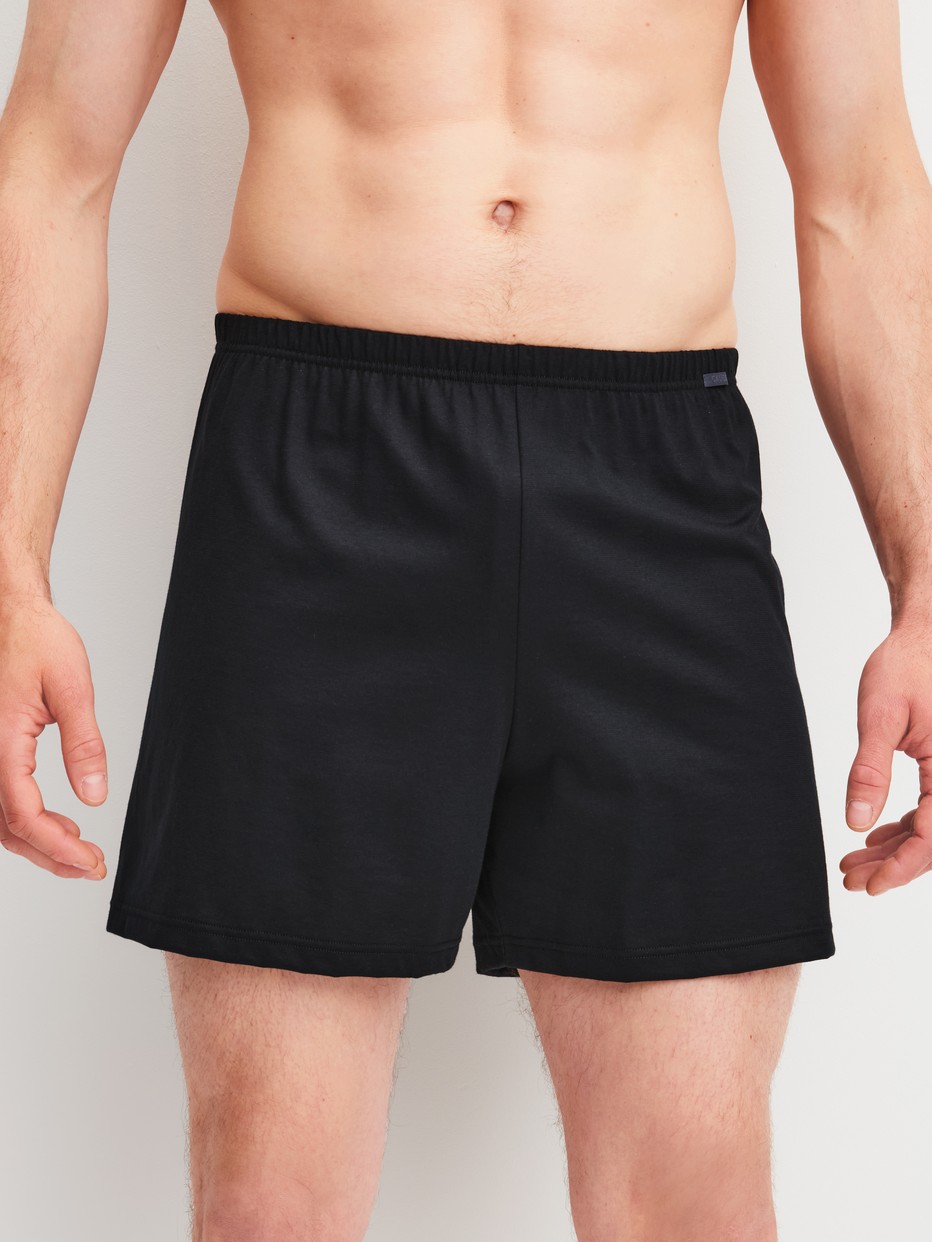 Men model is wearing Boxer Shorts, 2-Pack made of 100% Cotton in Black, Striped from the Cotton Special series by CALIDA, Additional Image