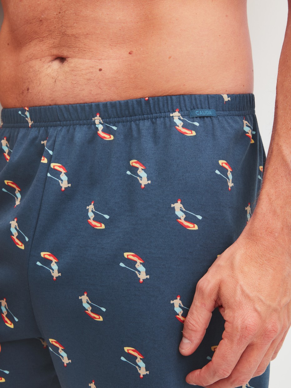 Men model is wearing Boxer shorts made of Cotton in Blue, Patterned from the Prints series by CALIDA, Detail