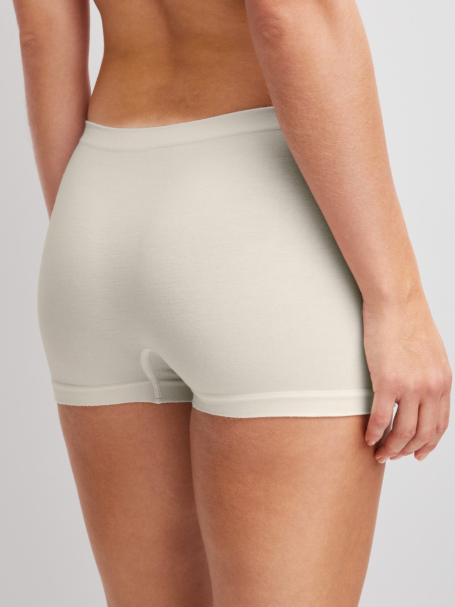 Women model is wearing Shorty regular cut made of Modal in White, Unicoloured from the Seamless Natural series by CALIDA, Back view