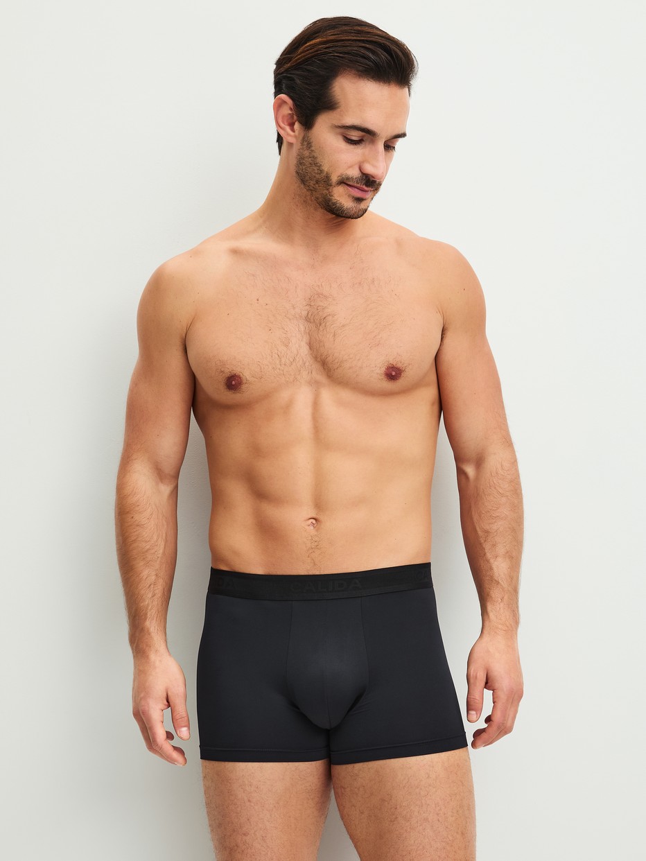Men model is wearing Boxer brief made of Polyamide in Black, Unicoloured from the Micro Stretch series by CALIDA, Outfit