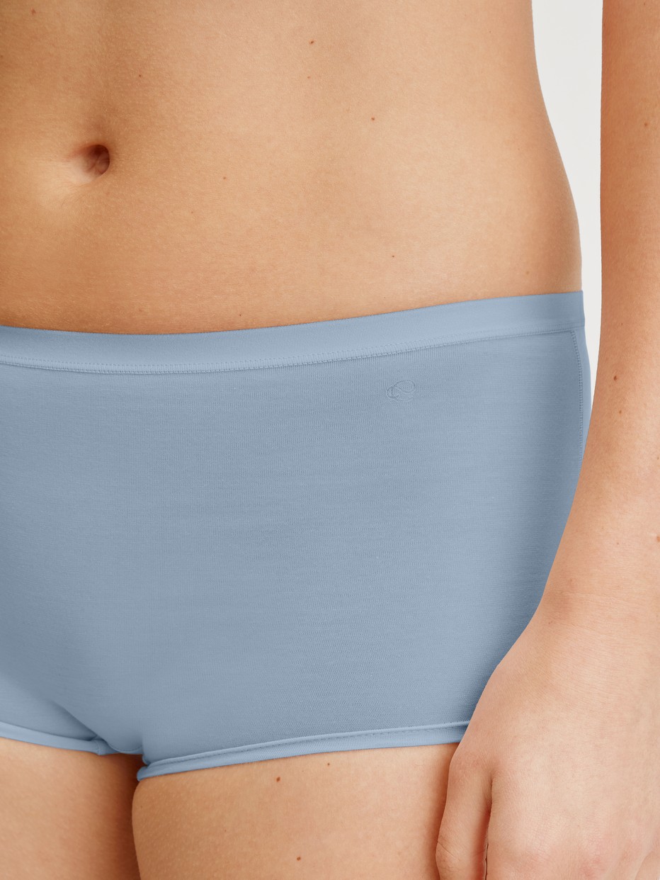 Women model is wearing Shorty regular cut made of Swiss+Cotton in Grey, Unicoloured from the Natural Comfort series by CALIDA, Detail