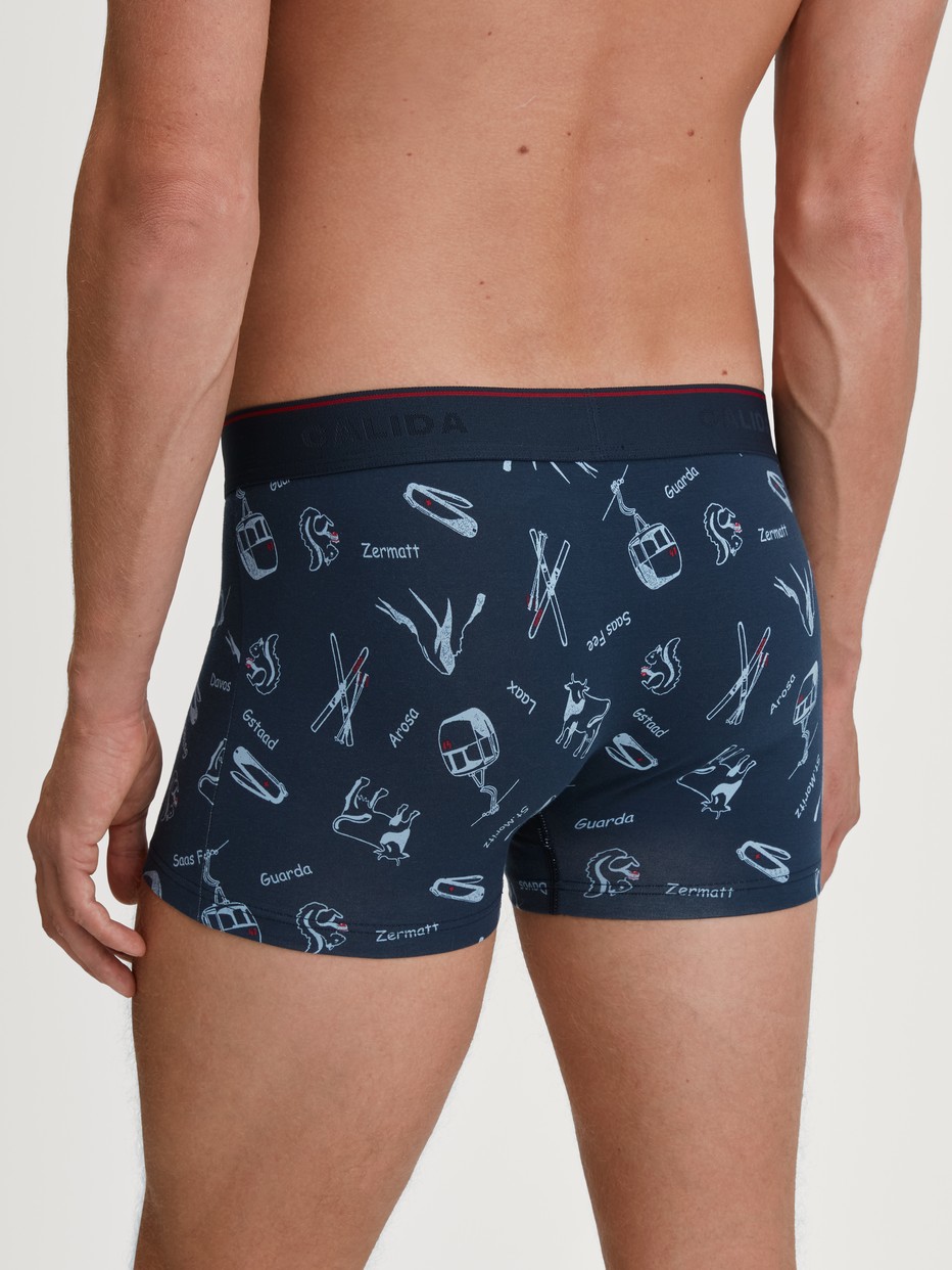 Men model is wearing Boxer brief made of Cotton in Blue, Motif from the Swiss Resort series by CALIDA, Back view