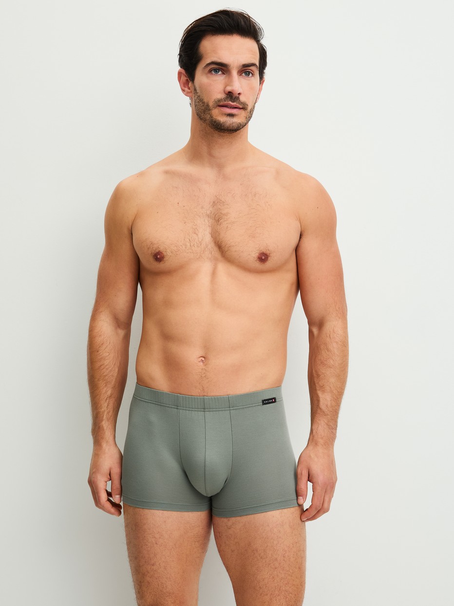 Men model is wearing Boxer brief made of Cotton in Green, Unicoloured from the Evolution series by CALIDA, Outfit