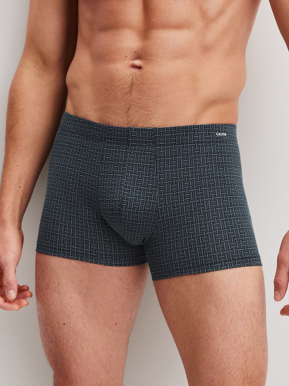 Men model is wearing Boxer brief made of Cotton in Black, Patterned from the Cotton Code Design series by CALIDA, Front view