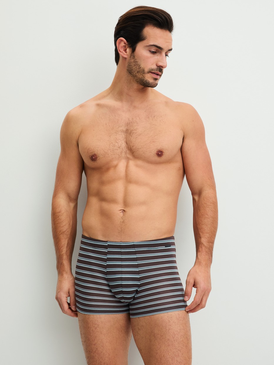 Men model is wearing Boxer brief made of Lyocell in Brown, Striped from the Focus Trend series by CALIDA, Outfit