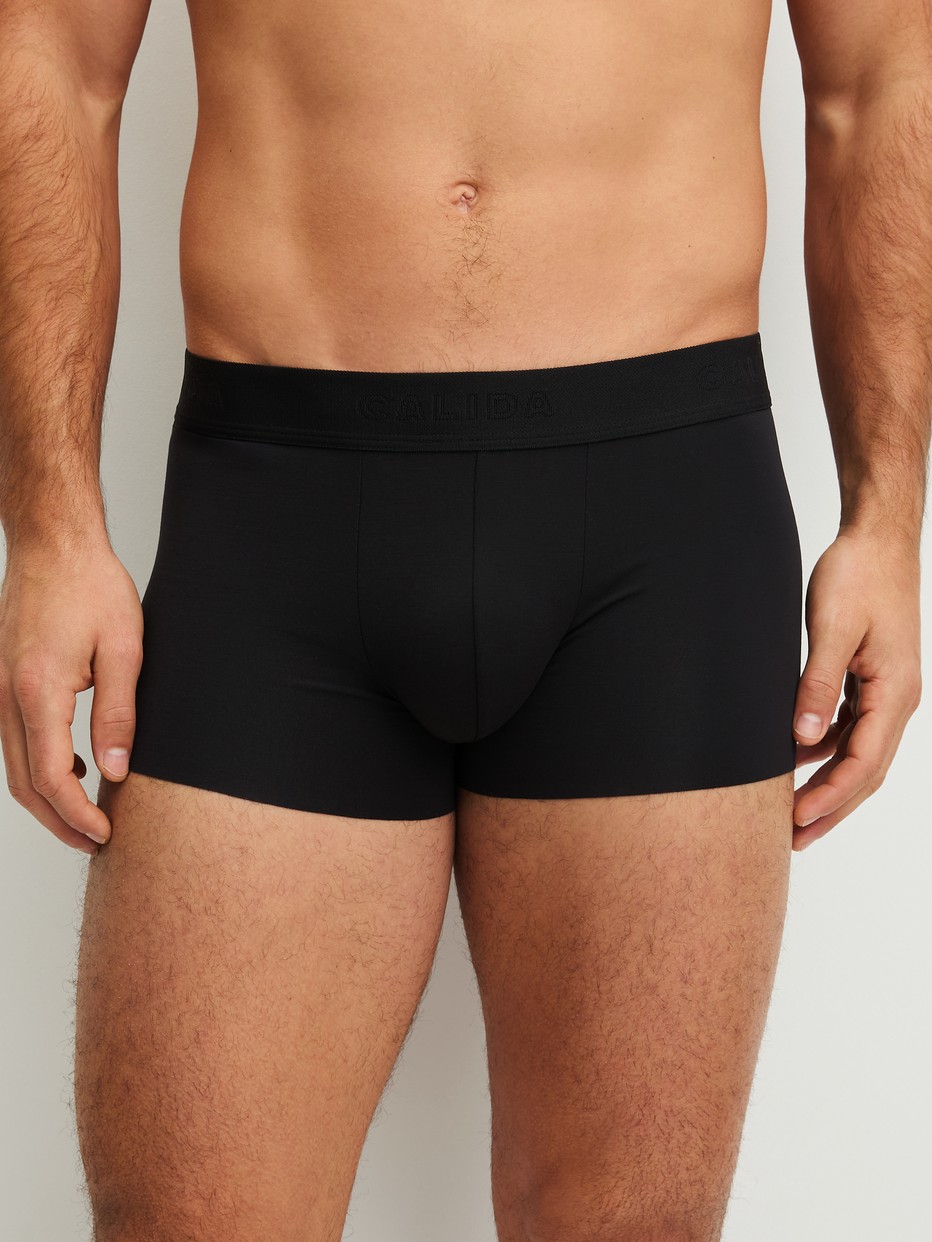 Men model is wearing Boxer brief with elastic waistband made of Modal in Black, Unicoloured from the Clean Line series by CALIDA, Front view