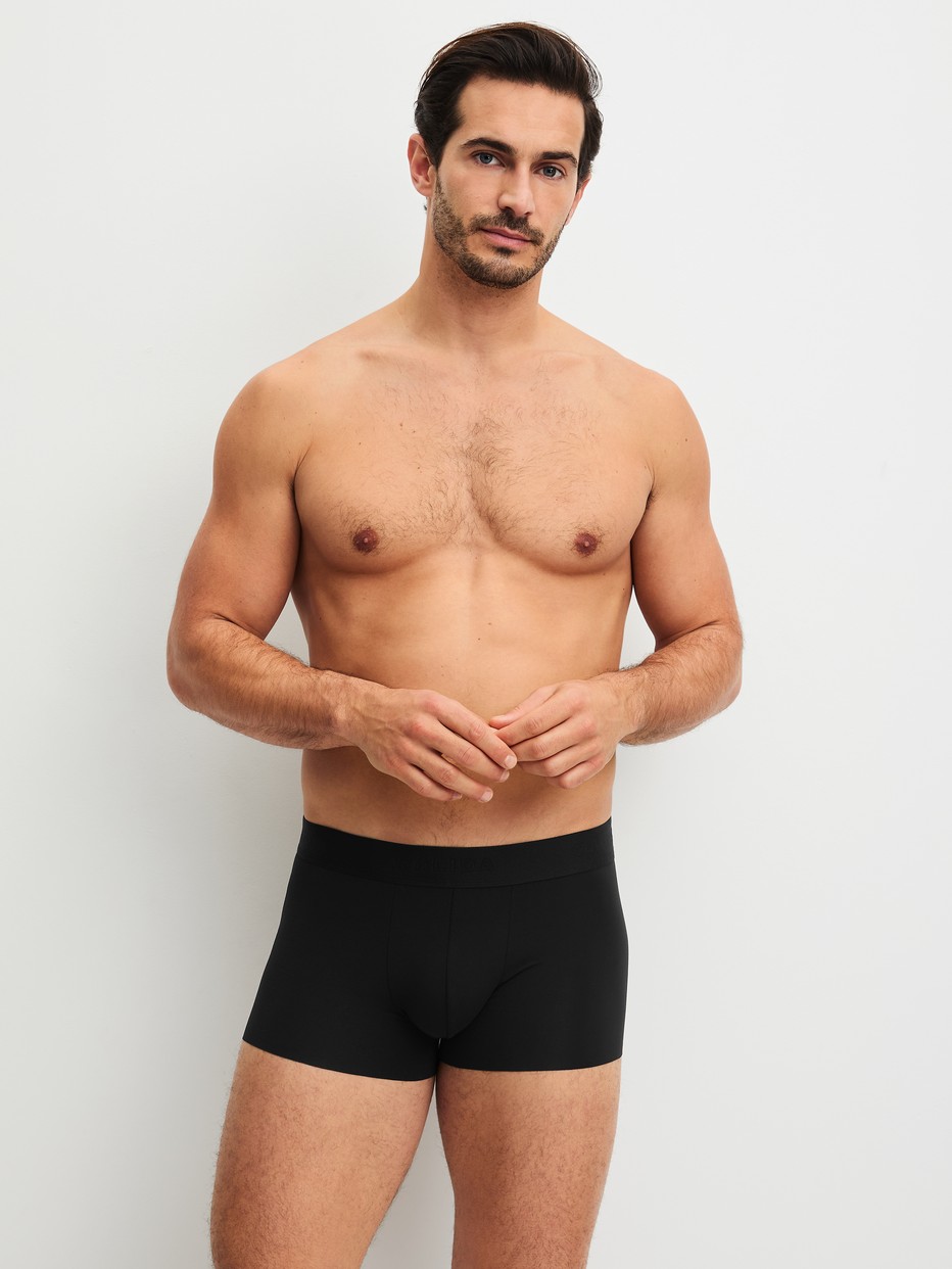 Men model is wearing Boxer brief with elastic waistband made of Modal in Black, Unicoloured from the Clean Line series by CALIDA, Outfit