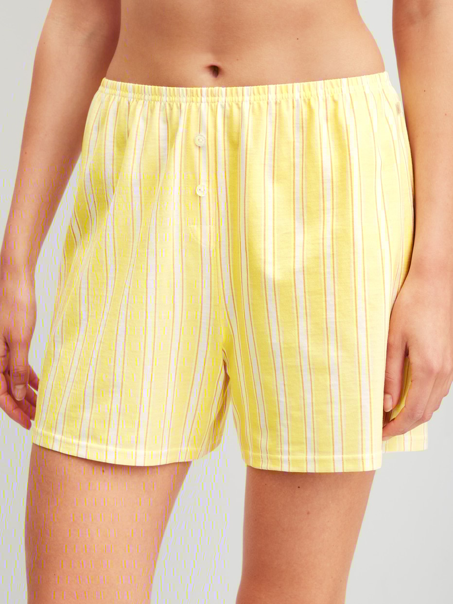 Women model is wearing Pyjama shorts made of 100% Cotton in Yellow, Unicoloured from the Favourites Ocean series by CALIDA, Front view