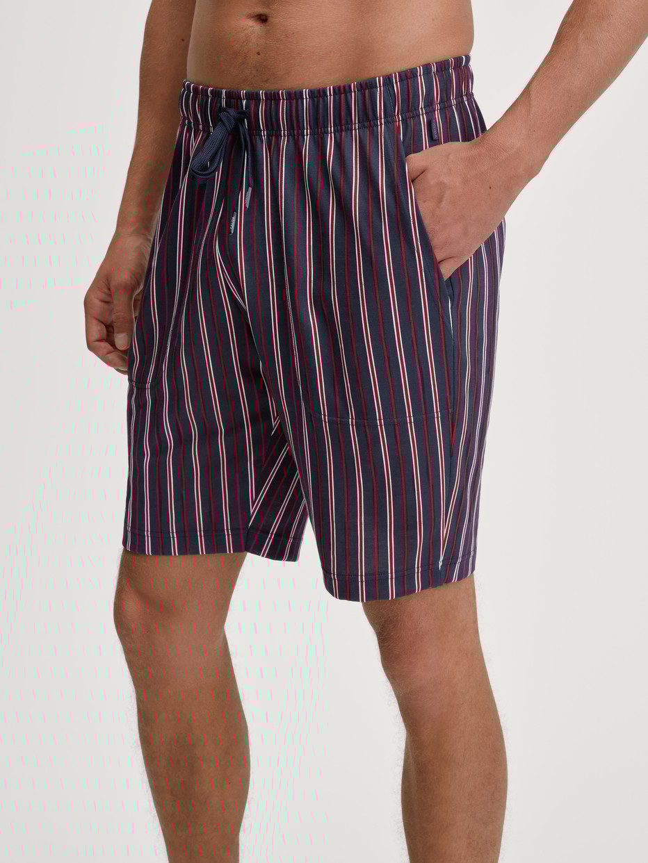 Men model is wearing Bermudas made of 100% Cotton in Red, Checked from the Remix Basic Sleep series by CALIDA, Front view