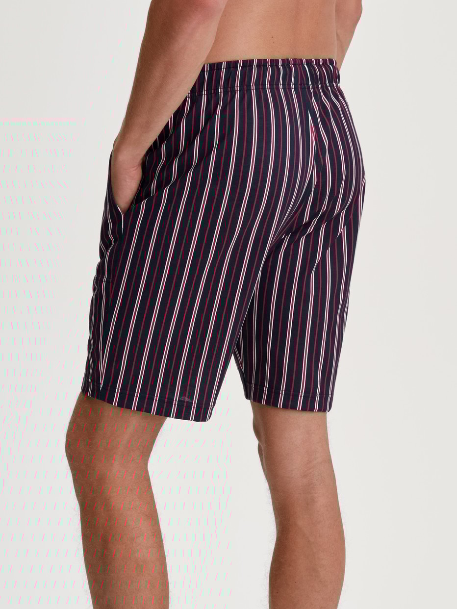 Men model is wearing Bermudas made of 100% Cotton in Red, Checked from the Remix Basic Sleep series by CALIDA, Back view