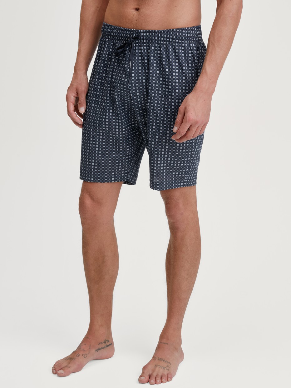 Men model is wearing Bermudas made of 100% Cotton in Blue, Checked from the Remix Basic Sleep series by CALIDA, Front view