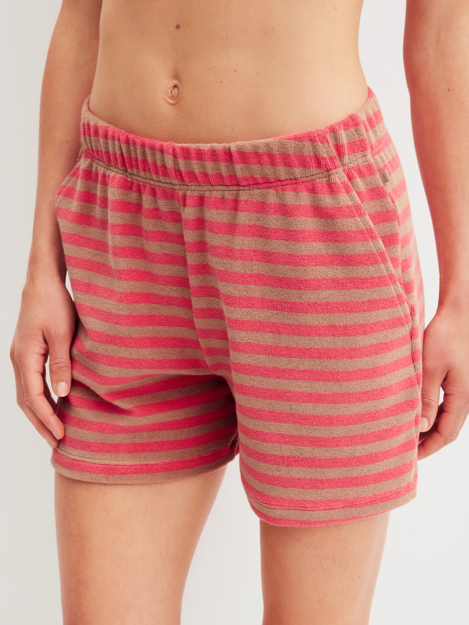Women model is wearing Terry lounge shorts made of Cotton in Brown, Striped from the Lounge Stripe series by CALIDA, Front view