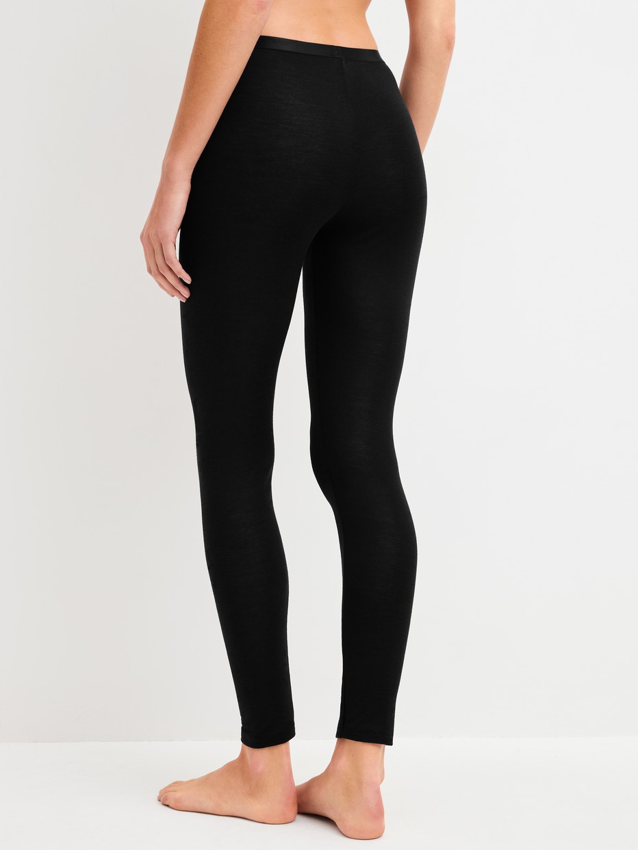 Women model is wearing  made of Wool in Black, Unicoloured from the True Confidence series by CALIDA, Back view
