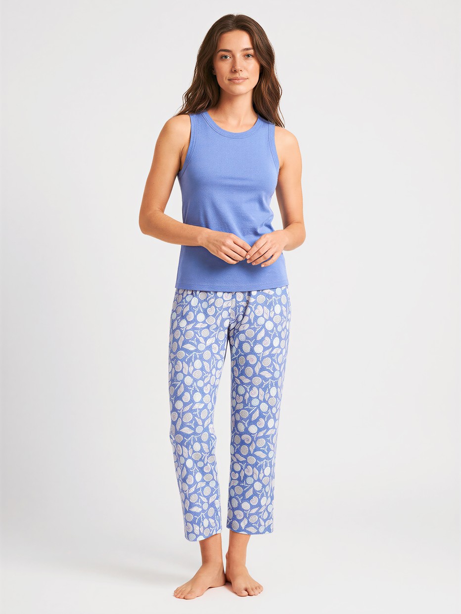 Women model is wearing 7/8 pyjama trousers made of 100% Cotton in Blue, Floral from the Favourites Ocean series by CALIDA, Outfit
