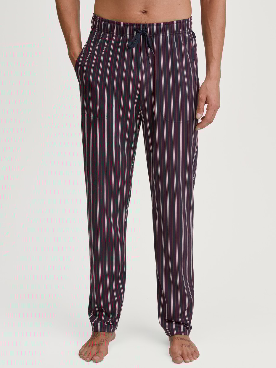 Men model is wearing Pyjama Bottoms with Side Pockets made of 100% Cotton in Red, Checked from the Remix Basic Sleep series by CALIDA, Front view