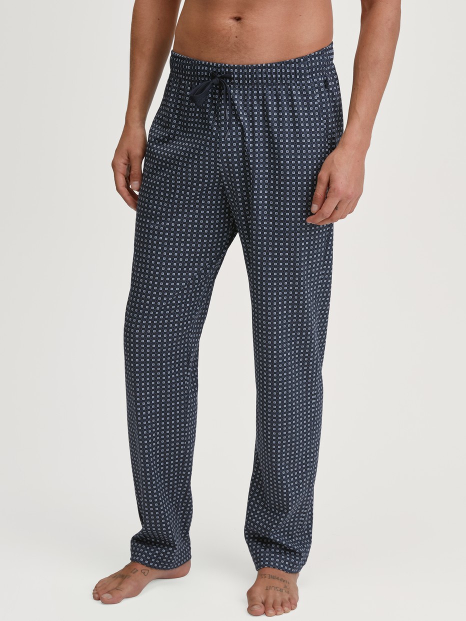 Men model is wearing Pyjama Bottoms with Side Pockets made of 100% Cotton in Blue, Checked from the Remix Basic Sleep series by CALIDA, Front view
