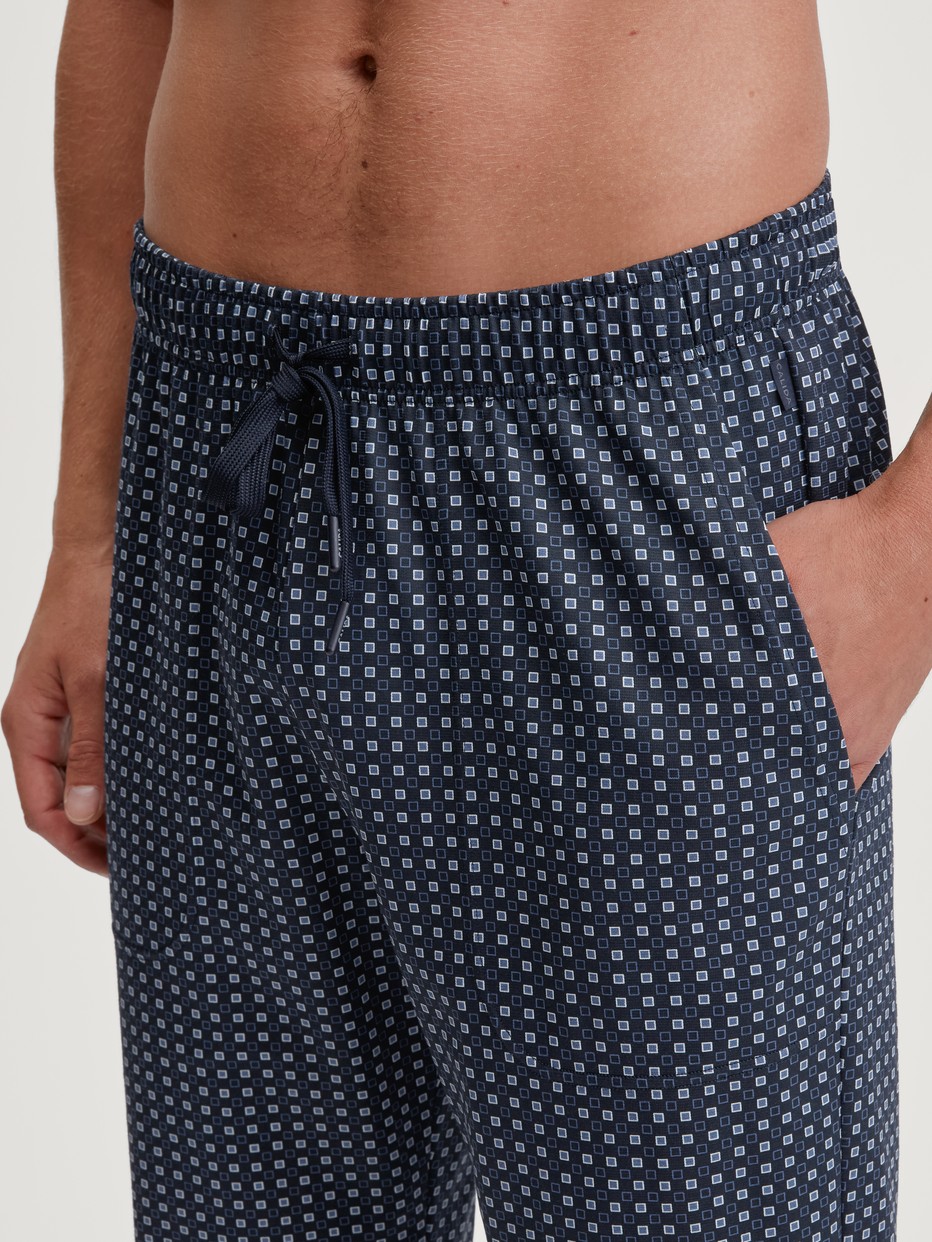 Men model is wearing Pyjama Bottoms with Side Pockets made of 100% Cotton in Blue, Checked from the Remix Basic Sleep series by CALIDA, Detail