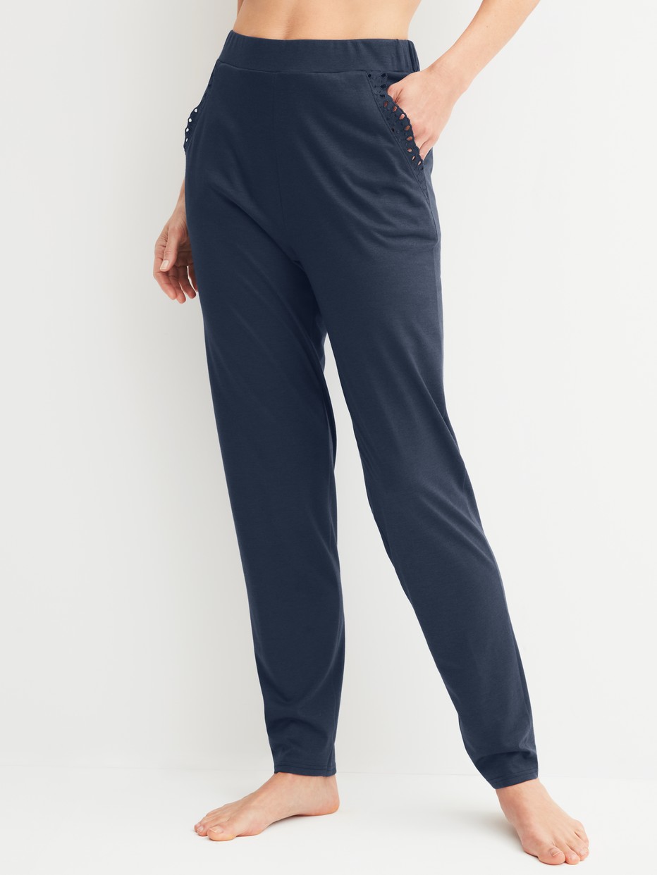 Women model is wearing Pyjama trousers with cuffs made of Cotton in Blue, Unicoloured from the Favourites Tiles series by CALIDA, Front view