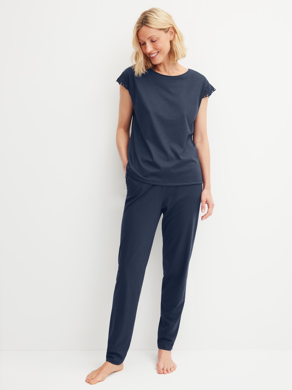 Women model is wearing Pyjama trousers with cuffs made of Cotton in Blue, Unicoloured from the Favourites Tiles series by CALIDA, Outfit