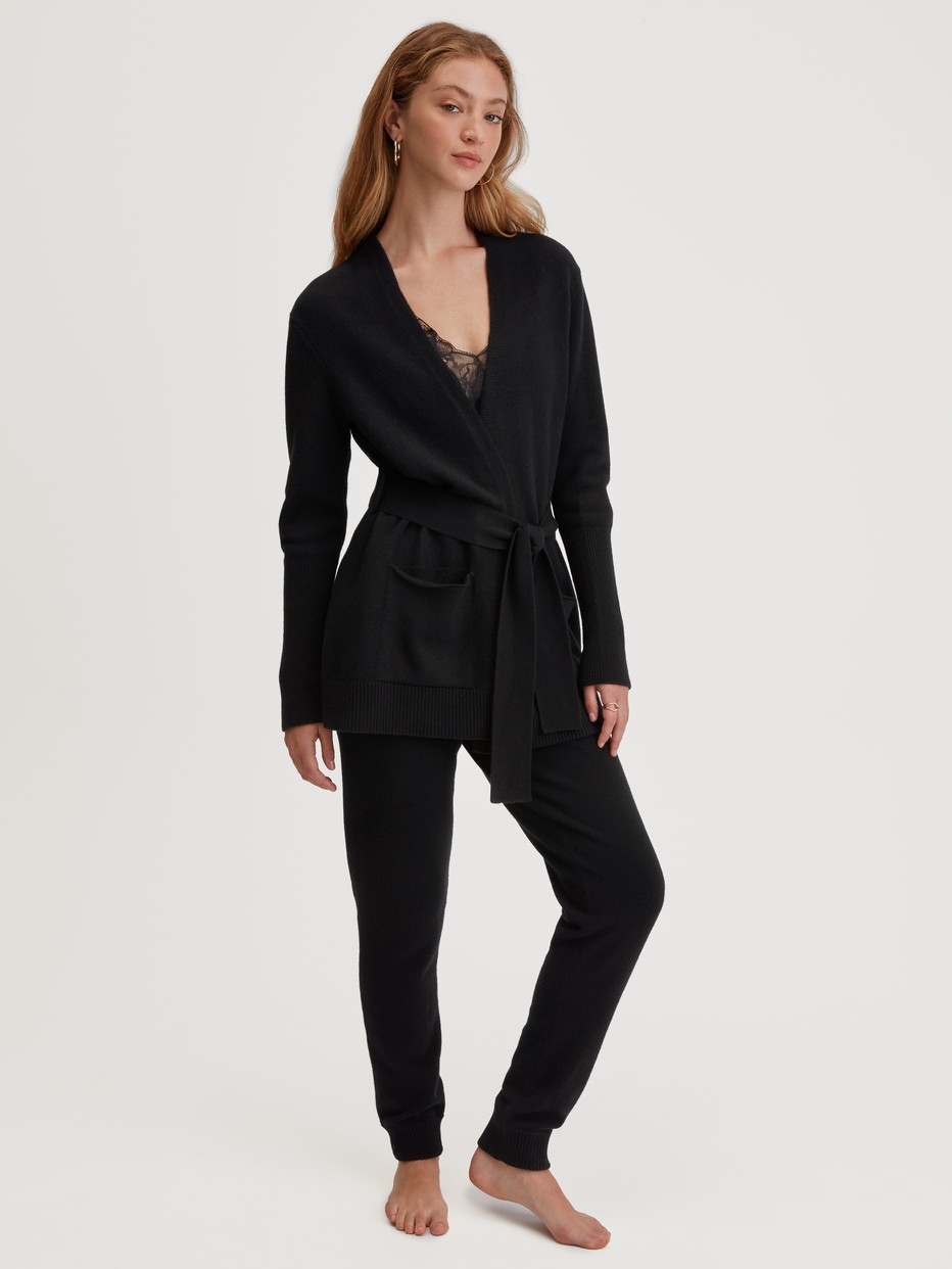 Women model is wearing Merino wool knitted trousers made of Wool in Black, Unicoloured from the The Cosy Collection series by CALIDA, Outfit