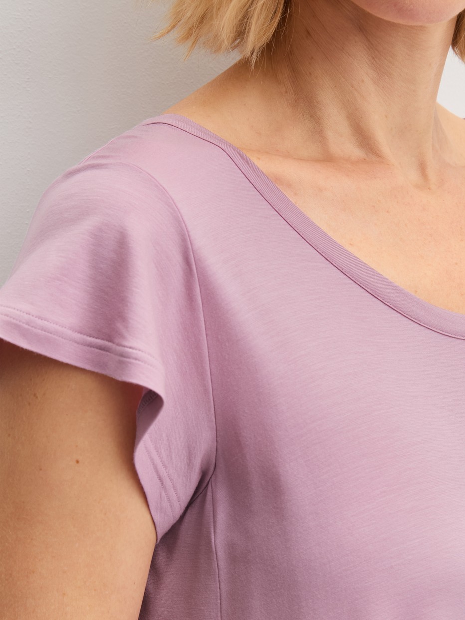 Women model is wearing Short-sleeved nightdress, length 90 cm made of Modal in Purple, Unicoloured from the DSW Balancing series by CALIDA, Detail