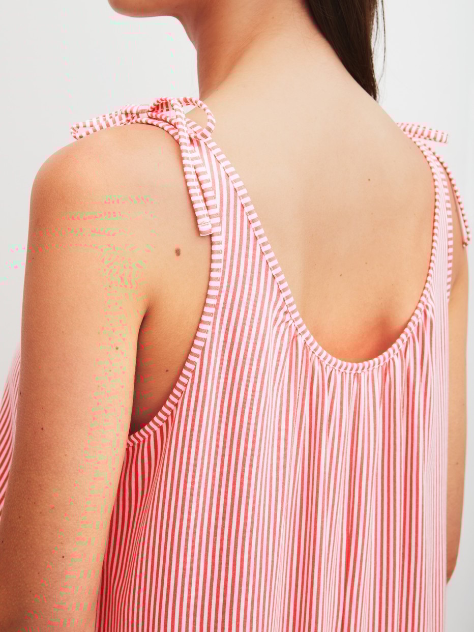 Women model is wearing Nightdress, length 125 cm made of Cotton in Pink, Unicoloured from the Favourites Beach series by CALIDA, Detail