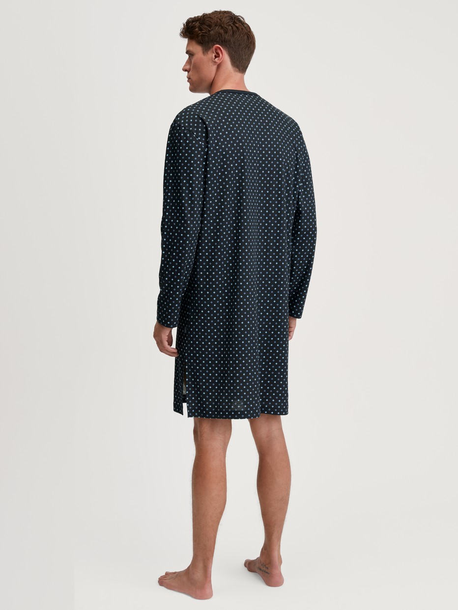 Men model is wearing Nightshirt made of 100% Cotton in Blue, Patterned from the Relax Streamline series by CALIDA, Back view