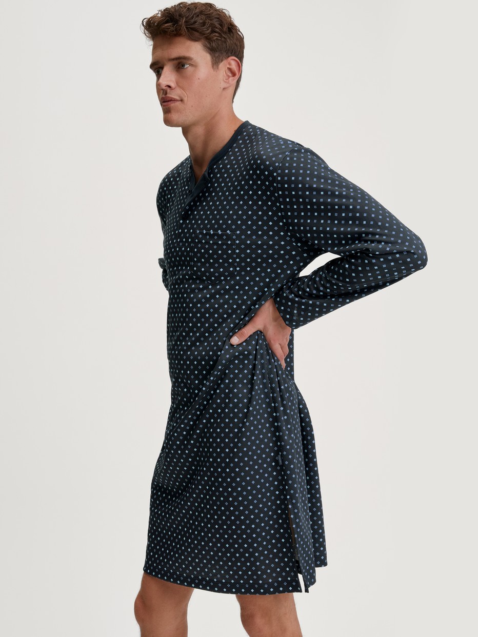 Men model is wearing Nightshirt made of 100% Cotton in Blue, Patterned from the Relax Streamline series by CALIDA, Front view