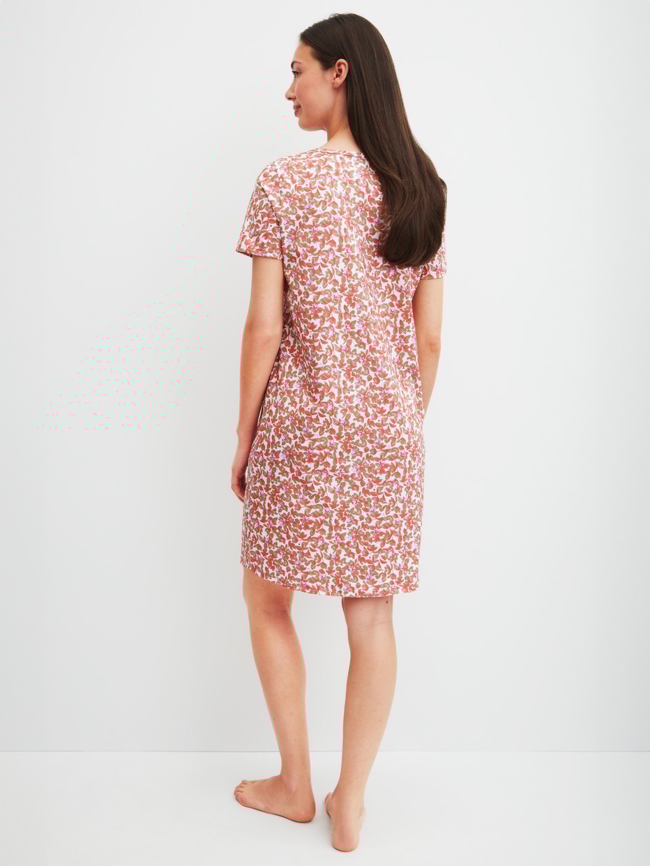 Women model is wearing Short-sleeved nightdress, length 95 cm made of 100% Cotton in Red, Floral from the Flower Nights series by CALIDA, Back view