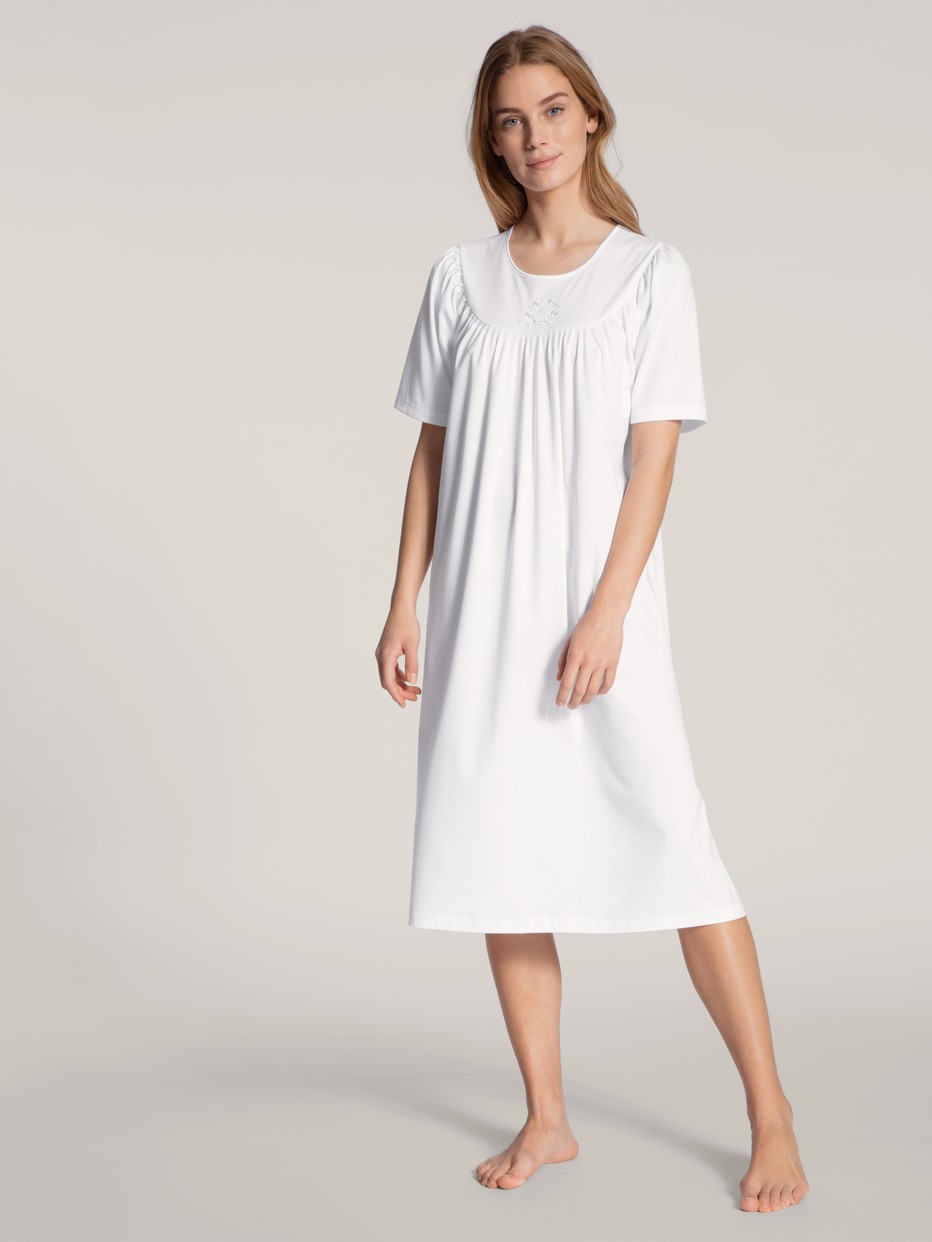 Women model is wearing Nightdress, length 120cm made of 100% Cotton in White, Unicoloured from the  series by CALIDA, Front view