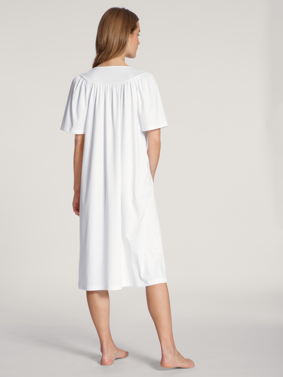 Women model is wearing Nightdress, length 120cm made of 100% Cotton in White, Unicoloured from the  series by CALIDA, Back view