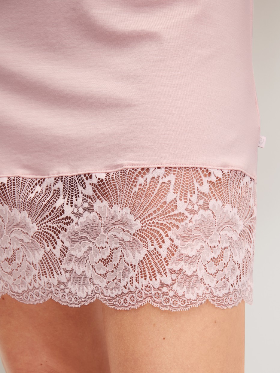 Women model is wearing Short-sleeved nightdress, length 95 cm made of Modal in Pink, Lace from the Elegant Dreams series by CALIDA, Detail
